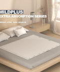 Heavy Duty Adult Underpads 40 By 60 Inches Hella Thick Disposable Bed Pads With Reinforced Cloth Backing Maximum Support Leak Proof Comfort 30 Count Discreet on a bed.