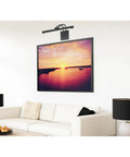 Living room with Dimmable LED Picture Light, 17 Inch, 15 Watt, Hardwired, Brushed Nickel Finish illuminating a sunset painting.