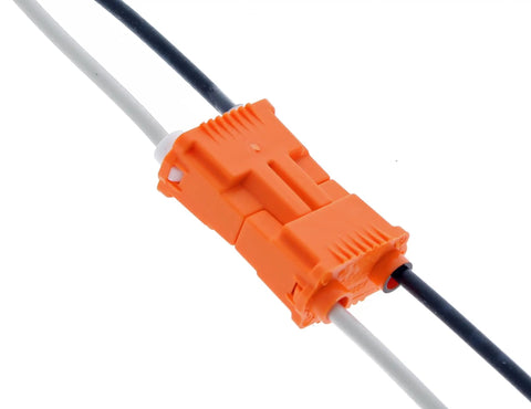 Close-up of Orange Two Wire Lighting Disconnect Plug 150 Pack With Push In Wire Locking Tech For Fast Safe Ballast Wiring On Your Fixtures And Easy Field Service Today connecting black and white wires.