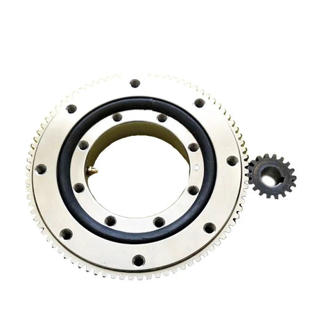 Top Shelf Small And Medium Support Bearings For Slewing Rings Built Tough Heavy Duty Rotation Parts Smooth Precision Industrial Pivot Components Rock Solid Ready For Any Rig Swap Today; top view of a large slewing ring bearing with a smaller gear.