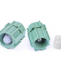 Two green adjustable water flow mushroom bubbler heads for 360 degree drip irrigation emitters fitting half inch tubing.