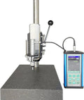 TopShelf Portable Ultrasonic Hardness Tester paired with NoFuss Test Stand, showing the unit on a flat surface with display.