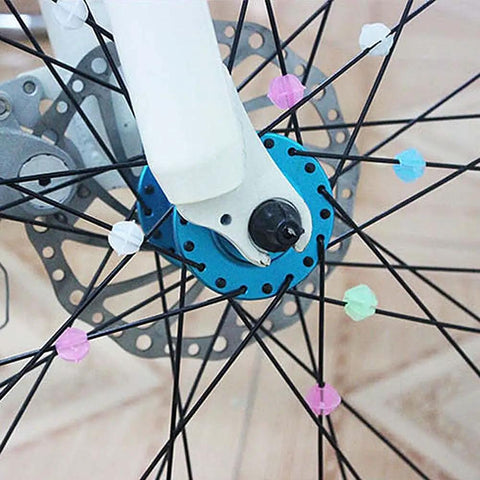 Multicolor Bicycle Spoke Beads Set With Luminous Plastic Clips on kids bike wheel, 72 piece decoration kit, close-up view