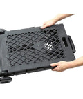 Person holding folded Pack-N-Roll Mesh Portable Tools Carrier 55 lb Load, Folding Cart with telescoping handle and secure lock.