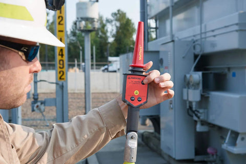 Field tech using High Voltage Detector Kit For Field Techs 30 V To 122 kV AC Intrinsically Safe Pro Grade MSHA Certified, Amprobe TIC 300 PRO.