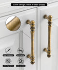 Close-up of 3 Inch Antique Brass Cabinet Pulls with aged finish, showcasing installation detail on white cabinet.