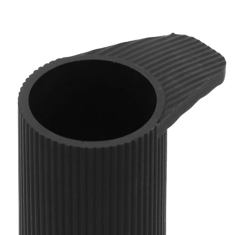 Close-up of black rubber grip from 8 Pack Keyboard Stand Feet Replacement Caps For Digital Pianos And Keyboards Shock Absorbing Non Marking Leg Protectors For Home Studio Easy Install And Secure No Slip.
