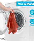 Person holding Bulk 200 Pack Microfiber Cleaning Cloths Shop Towels For Cars And Home Use by washing machine, red color, reusable.