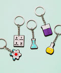 20 Pack Science Party Keychains Set Colorful Silicone Keyrings for Backpack and School Decor, Classroom Rewards, Bulk Party Favors, Totally Cute Chemical Themed Charms for Kids showing atom, flask, and STEM designs.