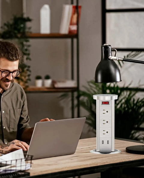 Man working at desk with Pop Up Power Outlet With Wireless Charger Automatic Lift 3 Outlets And 2 USB Ports 10W Fast Wireless Pad