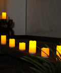 Lit Outdoor Solar Pillar Candles 3x6 Inches Waterproof Rechargeable Flameless Flickering Lights With Dusk To Dawn Sensor in garden