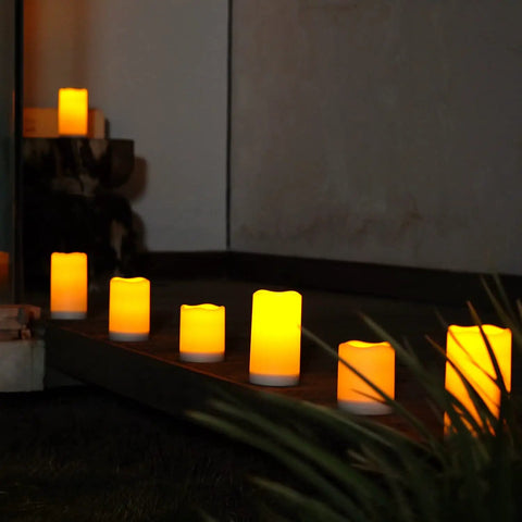 Lit Outdoor Solar Pillar Candles 3x6 Inches Waterproof Rechargeable Flameless Flickering Lights With Dusk To Dawn Sensor in garden