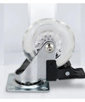 Close-up of a clear swivel caster wheel with brake, part of a set of 4 for furniture, 3 inch, heavy duty, 800 lb load capacity.