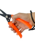 Hand holding All Purpose Hoof Trimming Tools For Goats Sheep Lamb Alpaca And Pig Hooves Carbon Steel Blades, orange handle