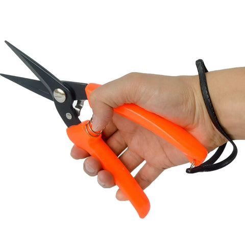 Hand holding All Purpose Hoof Trimming Tools For Goats Sheep Lamb Alpaca And Pig Hooves Carbon Steel Blades, orange handle