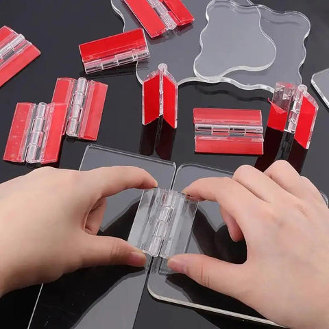 Hands using Clear Acrylic Self Adhesive Hinge Set, 4 Pack, 65x40mm Transparent Folding Hinges on black surface