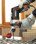 Knockout Impact Drill Packing 810 Watts And A Beefy 13 Mm Chuck Featuring Variable Speed Control in action drilling metal.