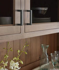 Sleek Contemporary Cabinet Pull In Matte Black Finish For Modern Kitchen Drawers And Furniture Hardware on wooden cabinetry.