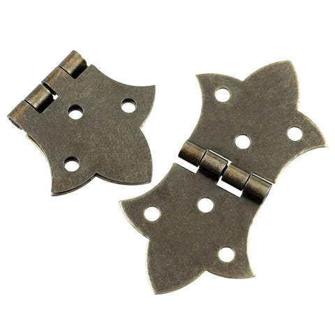 Close-up of two antique butterfly hinges from Eight Piece Antique Butterfly Hinges Set With Installation Screws For Vintage Wooden Boxes.