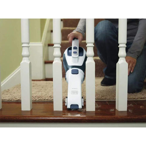 Cordless Lithium Hand Vacuum Dustbuster for Quick Cleanups Across Cars, Furniture, and Carpets being used on stairs