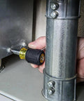 Person using 6-in-1 stubby screwdriver from All-In-One Screwdriver Kit for home repairs and projects, close-up view.
