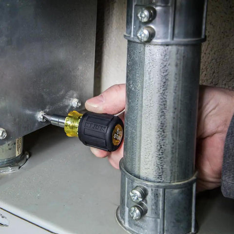 Person using 6-in-1 stubby screwdriver from All-In-One Screwdriver Kit for home repairs and projects, close-up view.