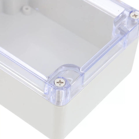 Sturdy White Plastic Junction Box With Clear Dustproof Cover For Electrical Project Setups showing corner detail and screw.