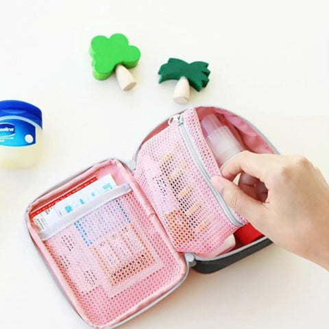 Open Pink Mini Outdoor First Aid Kit Bag For Travel And Everyday Use with visible mesh pockets and organizer compartments