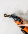 Starlock Plus Carbide Oscillating Saw Blade Built To Crush Through Stainless Steel Brick Cement Fiber And All Types Of Wood in use cutting a pipe.