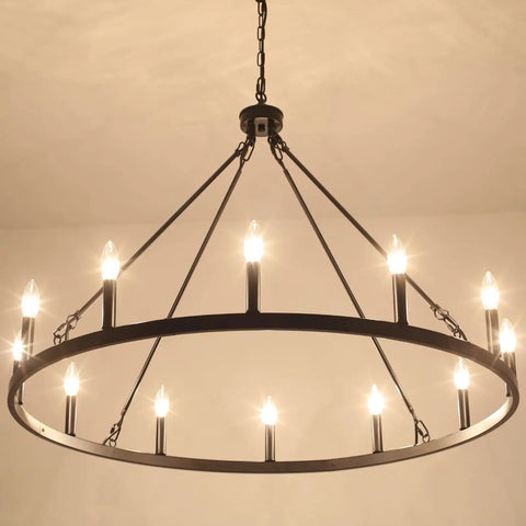 Matte Black 8 Light Farmhouse Chandelier Industrial Pendant Light Fixture with candles illuminated, hanging from ceiling.