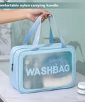 Go To Travel Toiletry Bag For Women And Men, Matte Translucent Organizer With Handy Handle, Waterproof PVC, Blue on bathroom counter