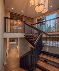 Real Deal Reclaimed Rustic Wood Stain Providing A Hella Smooth Water Based Finish That Reacts Naturally With Tannins To Create An Authentic Weathered Look Perfect For Interior Or Exterior Makeovers In A Convenient 55 Gallon Barrel showcased in modern staircase setting with elegant lighting.