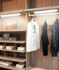 Plug In LED Tube Light Fixture With Linkable Design, 1.4Ft 1800LM 5000K installed in a closet above hanging clothes