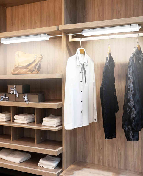 Plug In LED Tube Light Fixture With Linkable Design, 1.4Ft 1800LM 5000K installed in a closet above hanging clothes