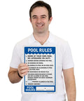 Man holding Pool Rules Sign 14 By 10 Inch Write On Aluminum With Four Corner Mount Holes Swim At Your Own Risk Shower Before Entering