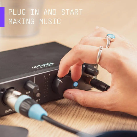 Hand adjusting knob on MiniFuse 2 USB Audio And MIDI Interface For Recording, Production, Podcasting, And Guitar, black finish