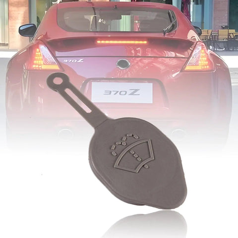 Windshield Washer Reservoir Cap Replacement Fits Infiniti Q60 2014 2016, Nissan 370Z 2009 2018, And Nissan Murano 2008 2014 OEM 28913JK60A Direct Fit Easy Install Durable Replacement Part shown close-up in front of red Nissan 370Z rear view.