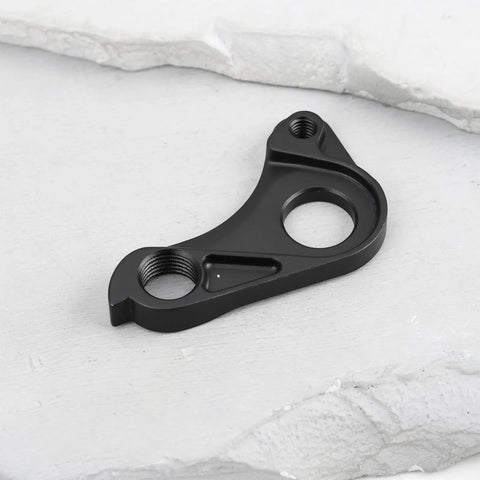 Black metal Direct Replacement Derailleur Hanger S206000001 For Specialized Aethos And Tarmac SL8 on white surface