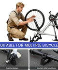 Two-Pack Portable Bike Repair Stands With Quick-Release Handlebar Support, Heavy-Duty Maintenance Workstands, shown with bike and user