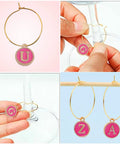 Rose Red Enamel Alphabet Charms And Golden Wine Glass Marker Rings Set Including 52 Alphabet Charms And 60 Marker Rings For Wine Tasting Parties Party Favors Gift Decor And Beading Hoops For Diy Jewelry Or Crafts displayed with letters Q, U, Z, A