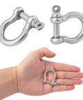 Hand holds 1/4 inch shackle from 25 Pack One Quarter Inch 304 Stainless Steel D Ring Shackles Set For Outdoor Adventure And Recovery Traction Wire Heavy Duty Bow Shape Anchor Shackles Six Millimeter Tough As Nails Gear For Camping Hiking Off Road