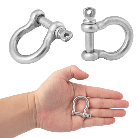 Hand holds 1/4 inch shackle from 25 Pack One Quarter Inch 304 Stainless Steel D Ring Shackles Set For Outdoor Adventure And Recovery Traction Wire Heavy Duty Bow Shape Anchor Shackles Six Millimeter Tough As Nails Gear For Camping Hiking Off Road