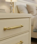 Fluted Champagne Bronze Cabinet Pulls 5 Inch Hole Center 10 Pack Decorative Hardware Handles For Kitchen Cabinets And Vanities With Timeless Elegance For Everyday Use installed on beige drawer