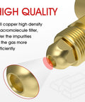 Close-up of brass welding gas regulator fitting with visible internal mesh filter