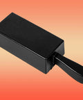 Side view of black cast-iron 100 oz loaf ingot mold with handle