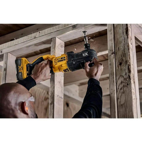 Boss Level 20V Max Brushless Compact Stud And Joist Drill With No Sweat Quick Change Chuck and Smart Anti Rotation Safety Brake in use on a framing site.