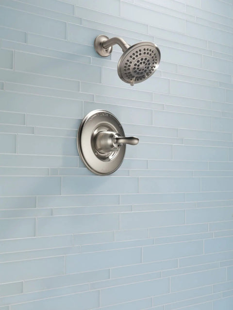 Linden 14 Series Shower Trim Kit With 5 Spray Touch Clean Shower Head in Venetian Bronze installed on light blue tiled wall