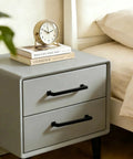 Matte Black Cabinet Pulls Pack Of 20, 5 Inch Length on gray dresser with clock and books