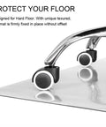 Close-up of chair wheels on Clear Chair Mat For Hardwood Floors 30 By 48 Inches, Transparent Floor Protector For Wood And Tile