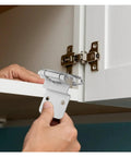Installing flush mount concealed cabinet hinge with soft close damper for quiet doors on a white kitchen cabinet